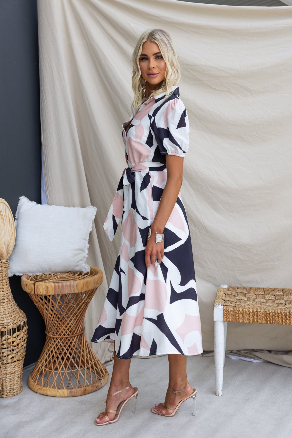 Chic Cappie Midi Dress in abstract design with button-up front, elastic sleeves, and removable tie.