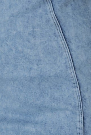 Close-up of light blue denim fabric showcasing texture and stitching details for Detroit Denim Dress.