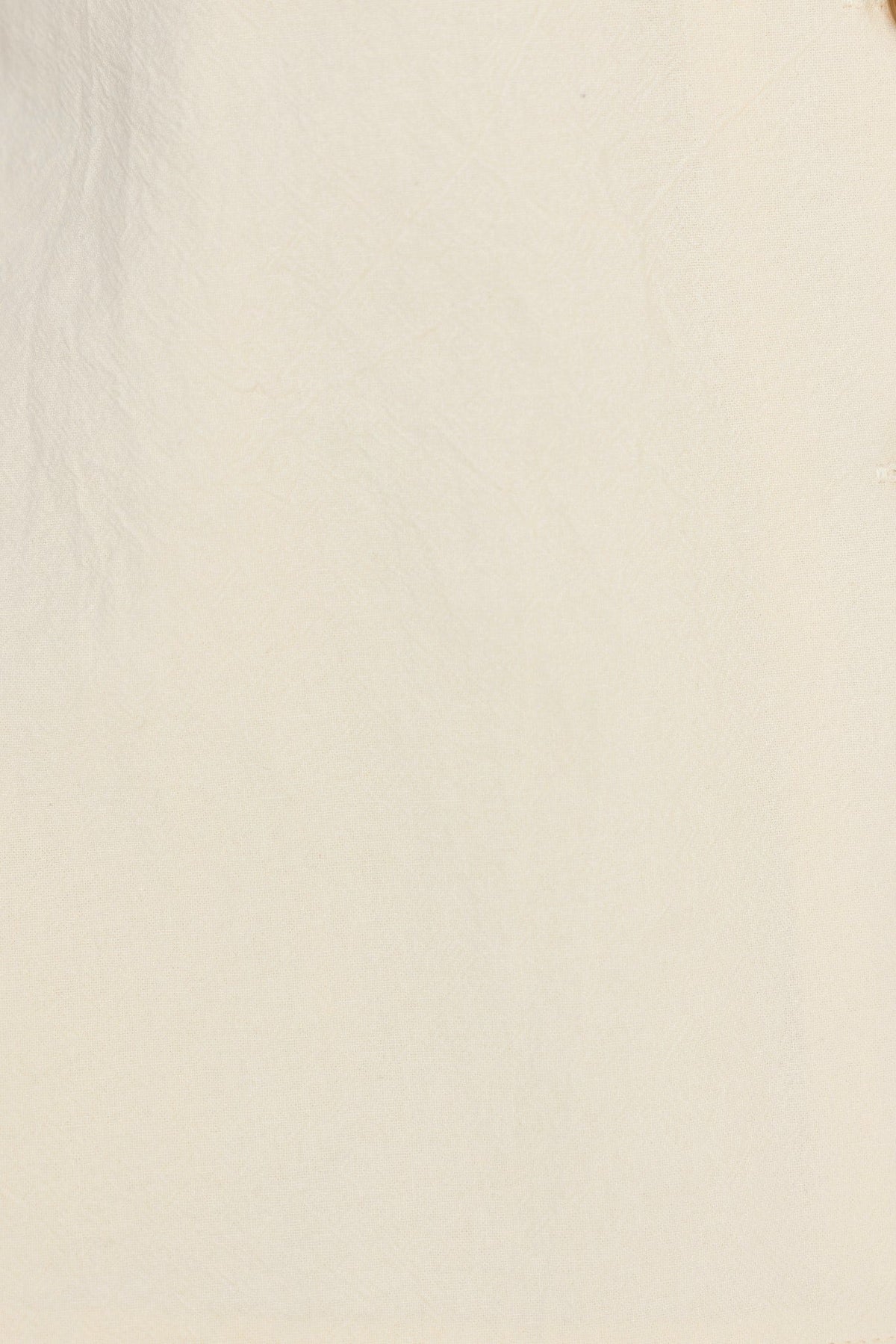 Vesper Pants close-up showing the smooth cream fabric and texture, perfect for a mid-high waist style.