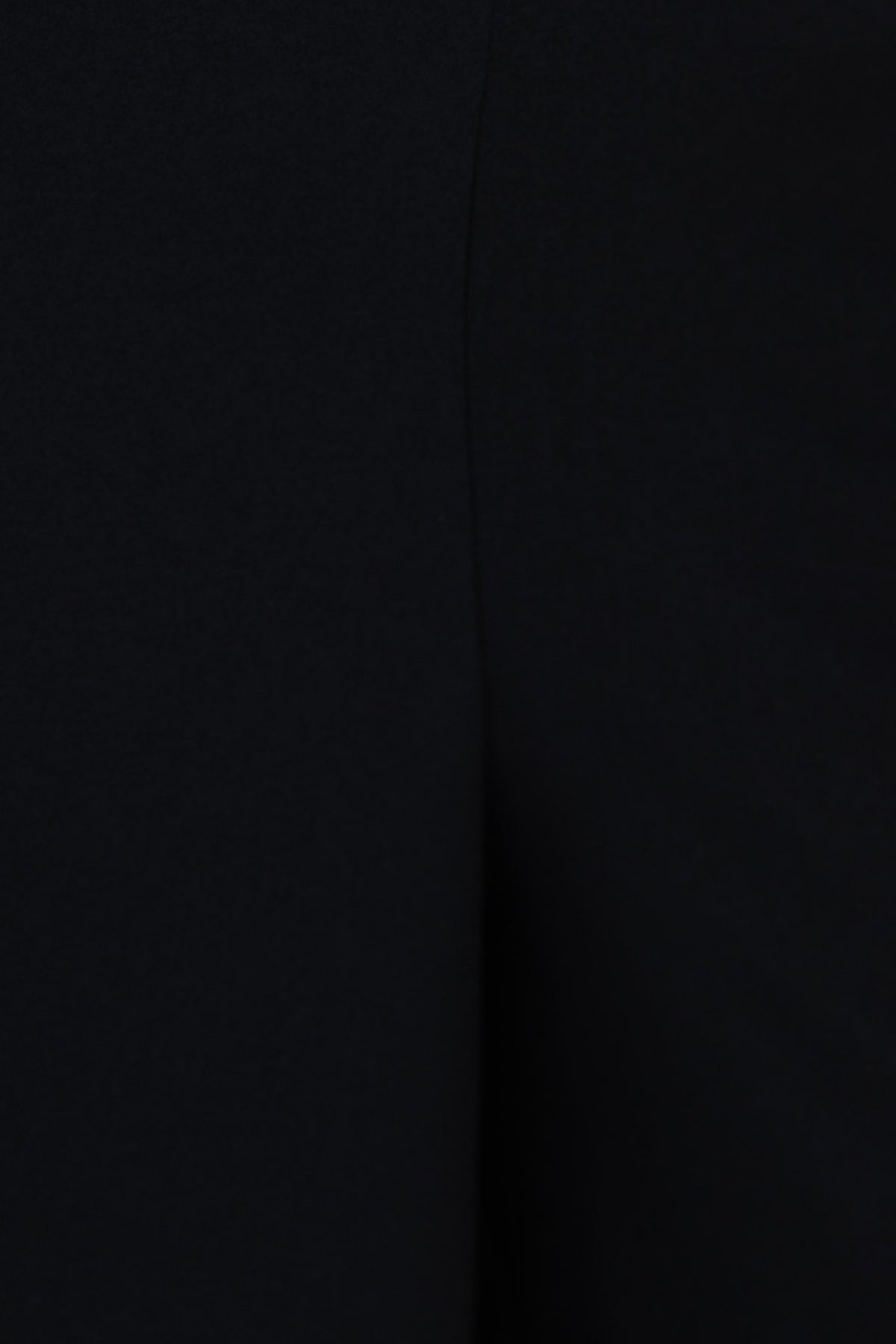 Close-up of the black crepe fabric of the Verde Top showcasing its texture and stretch material.