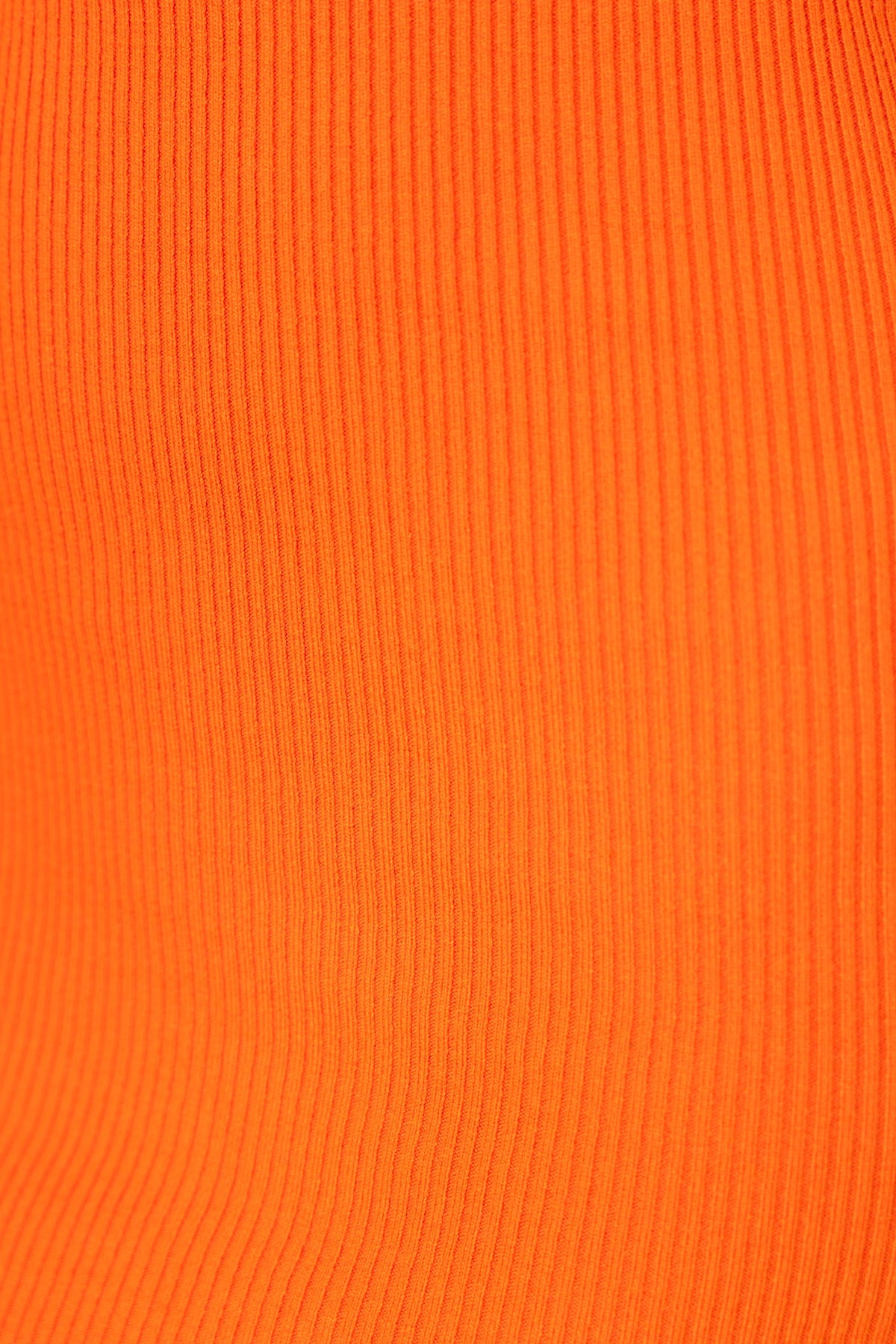 Close-up of ribbed knit fabric in vibrant orange color, showcasing texture and material stretch for Aleah Midi Dress.
