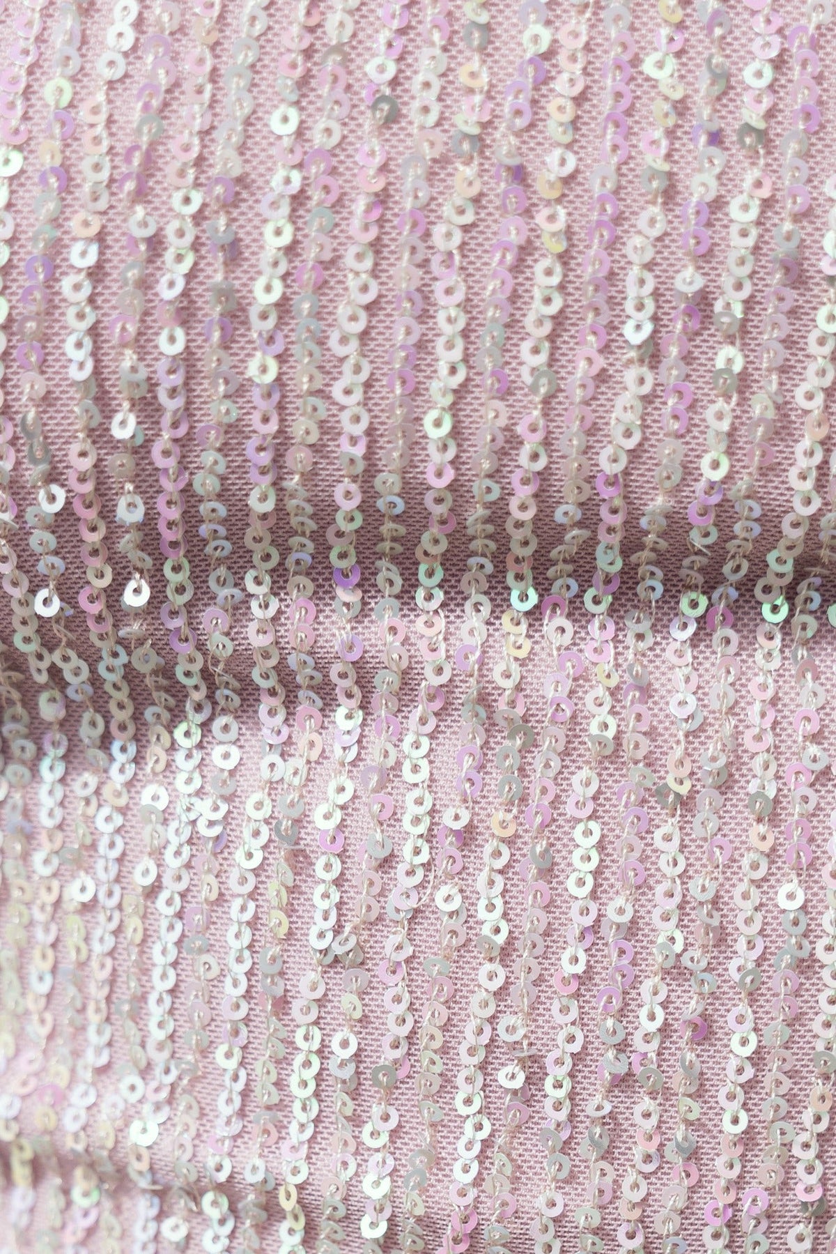 Close-up of sequin fabric on Wish On A Star Dress, showcasing shimmering details in pastel hues.