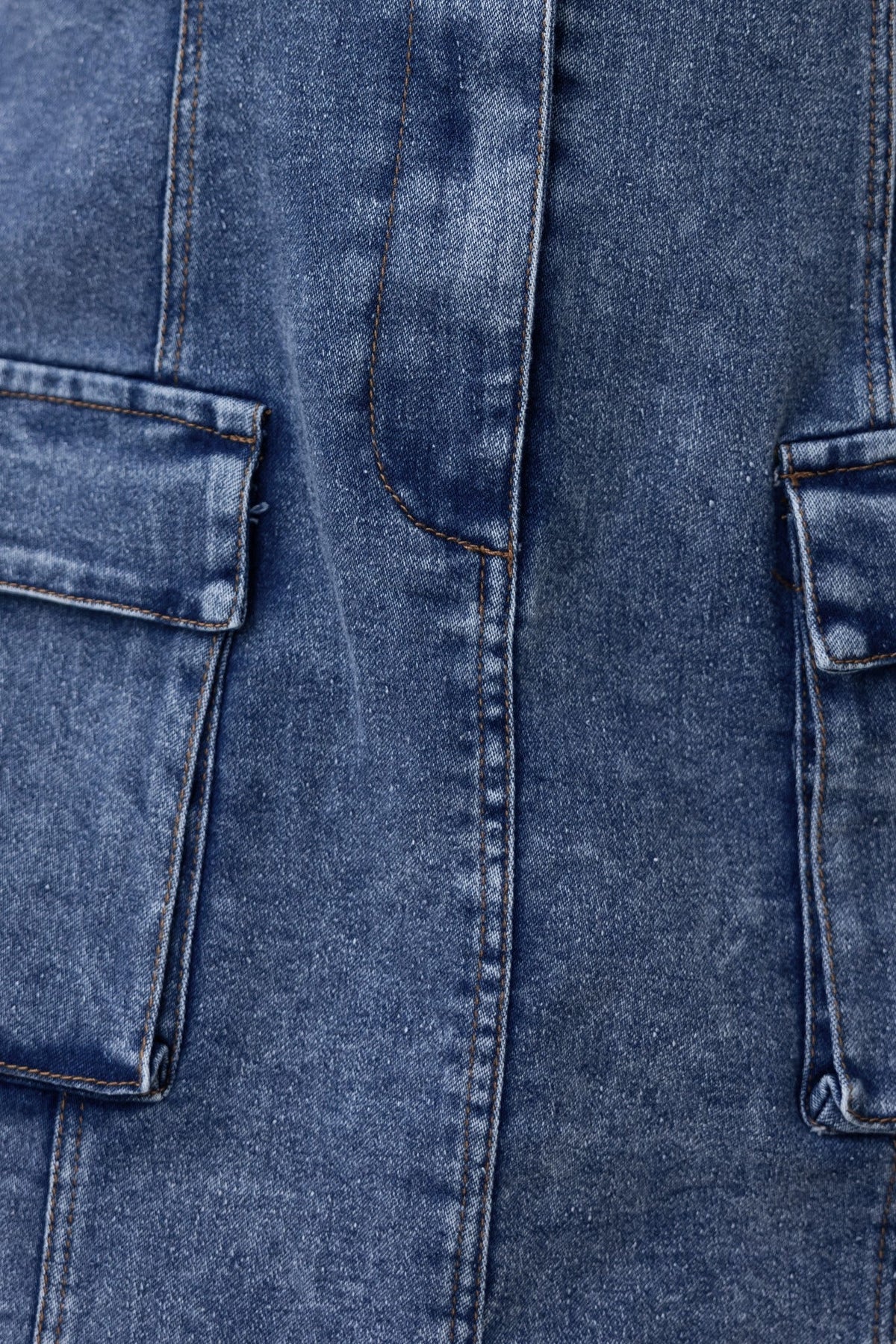 Close-up of the Harvey Denim Dress showing the button-up front and pockets in soft, stretchy denim.