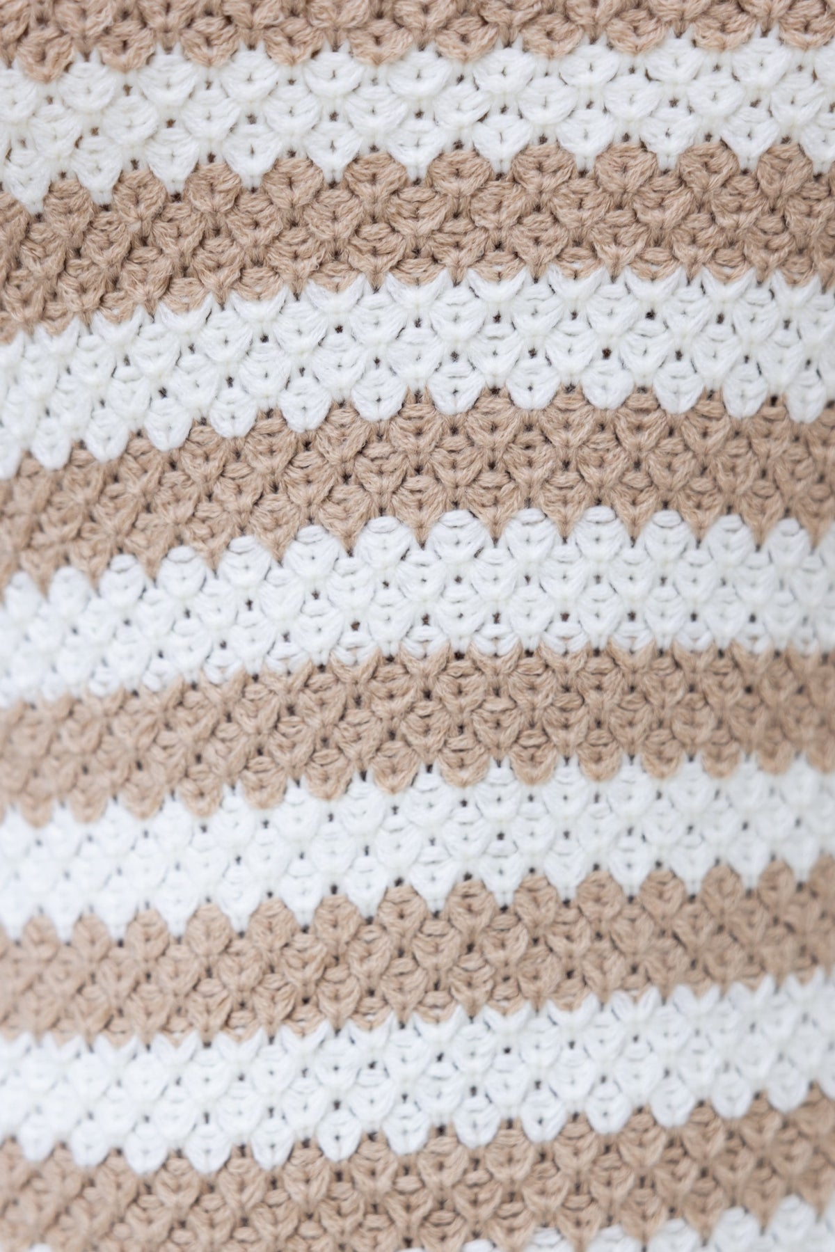 Close-up of textured knit fabric in beige and white stripes for the Liberty Maxi Dress.