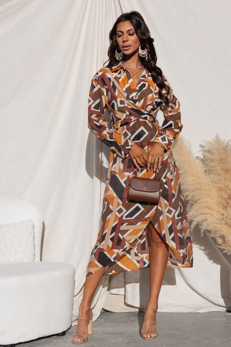 Model wearing a multi-colour Sommer Midi Dress with collar, button-up bust, and asymmetrical hemline.