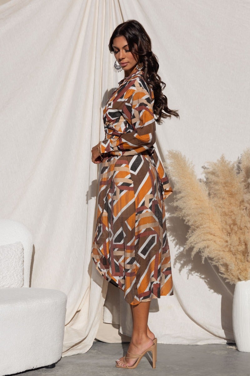 Side view of a multi-colour Sommer Midi Dress with a collared, button-up design and asymmetrical hemline.