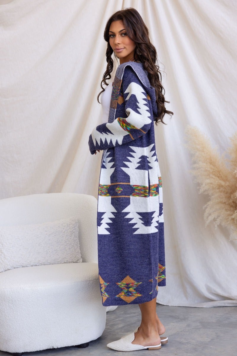 Navy print Lazuli Cardigan with longline fit, hood, and pockets, featuring geometric patterns and model wearing size S/M.