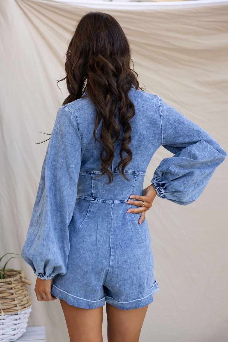 Back view of Nova Denim Playsuit featuring V-neckline, elastic cuffs, and relaxed fit for stylish comfort.