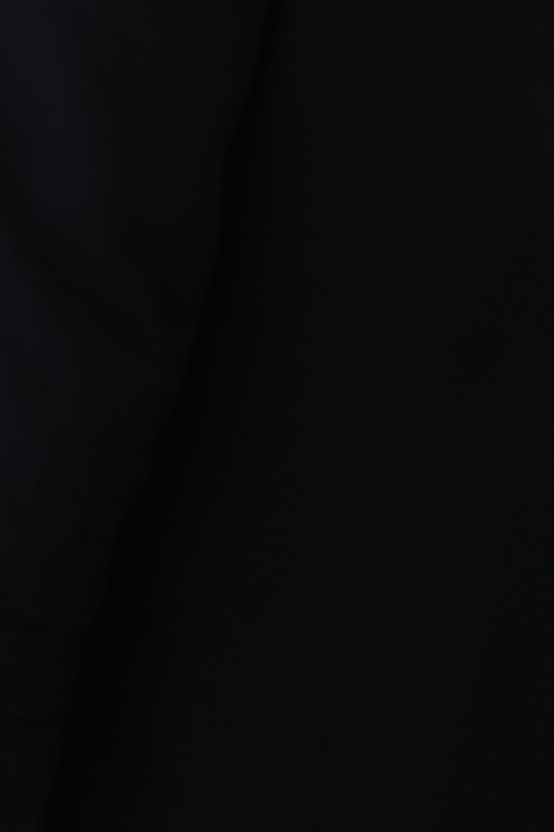 Close-up of the black cotton blend Santino blazer showcasing the fabric texture and shoulder pad design.