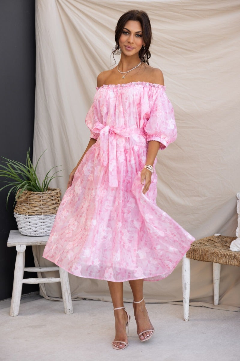Jenay Midi Dress in pink with embossed print, off-the-shoulder design, elastic cuffs, and removable belt.