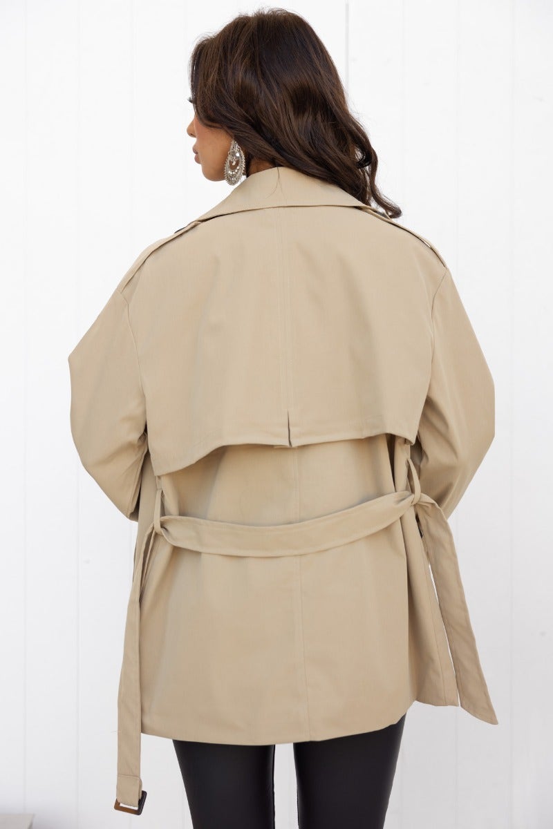 Back view of the Andie Jacket featuring a removable belt and oversized fit in a neutral color.