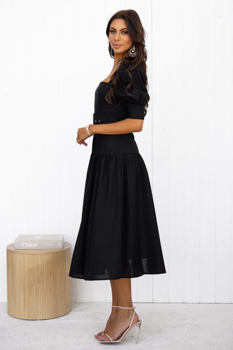Black linen blend Innis midi dress with square neckline and elastic cuffs, styled elegantly with a removable belt.