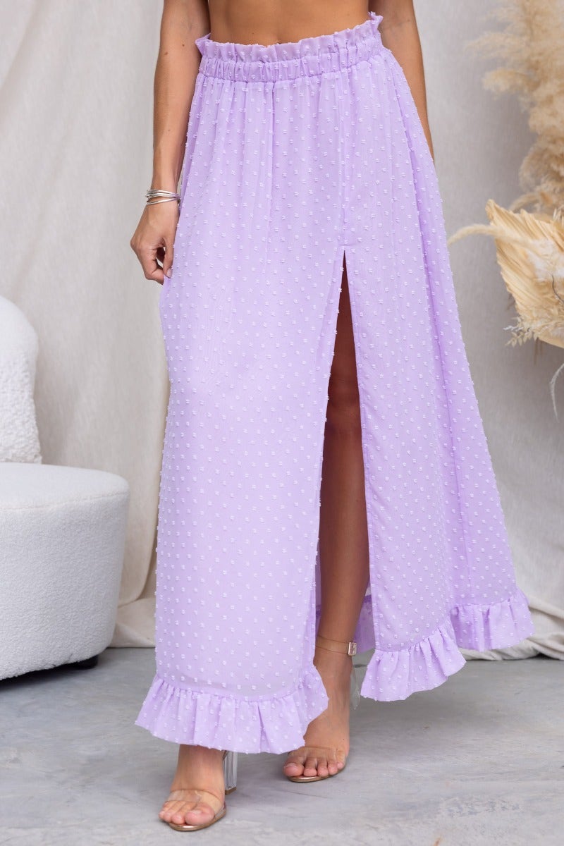 Rosalia Maxi Skirt in lavender with textured material, high front split, and ruffled hem for a stylish summer look.