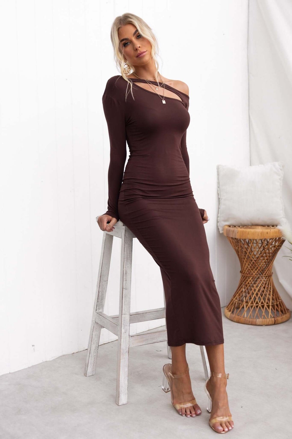Alatri Maxi Dress in brown, featuring a cut-out neckline, stretch cotton fabric, and standard fit, styled elegantly.