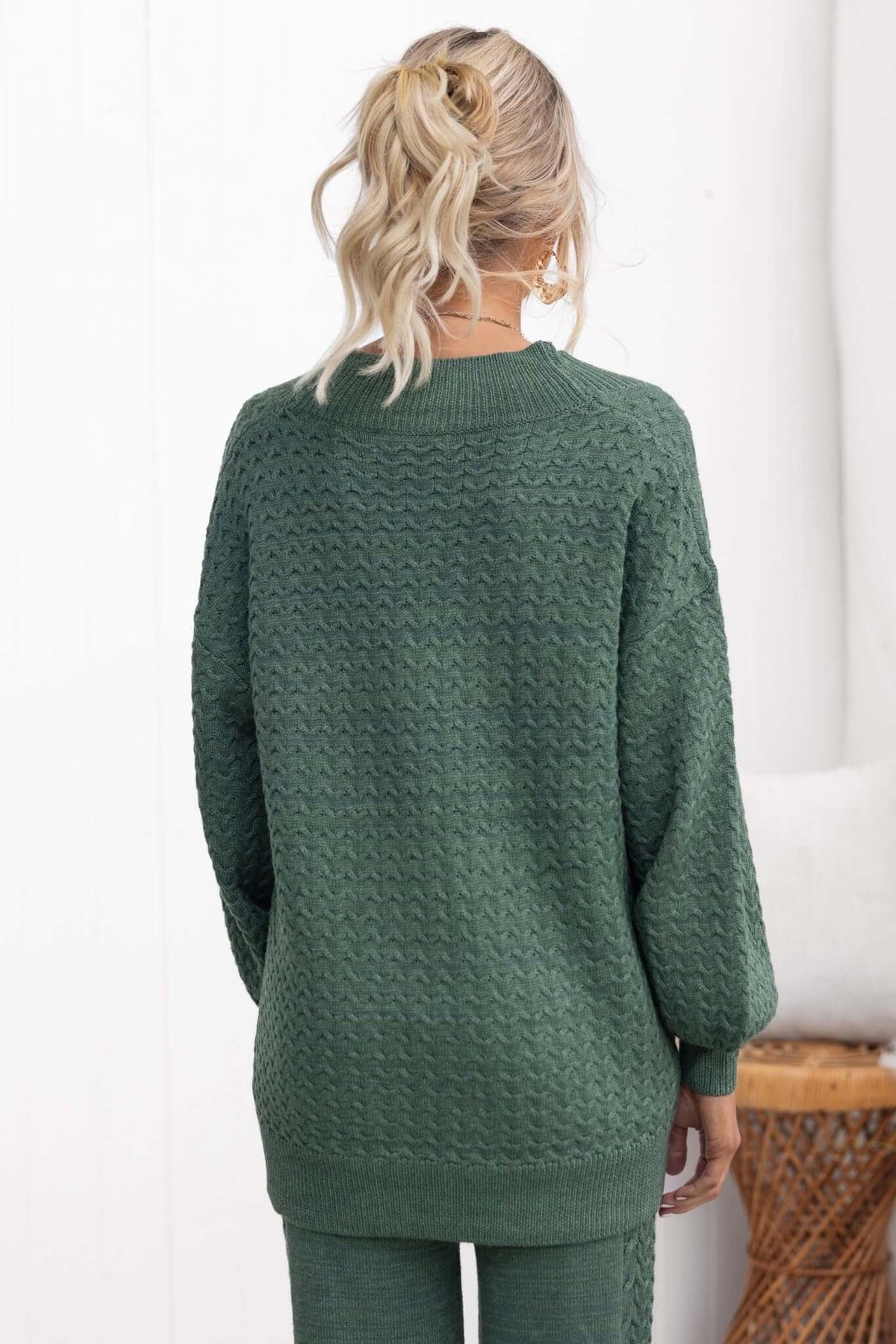 Back view of the Jesse Cardigan in green, featuring a relaxed fit and textured knit design.