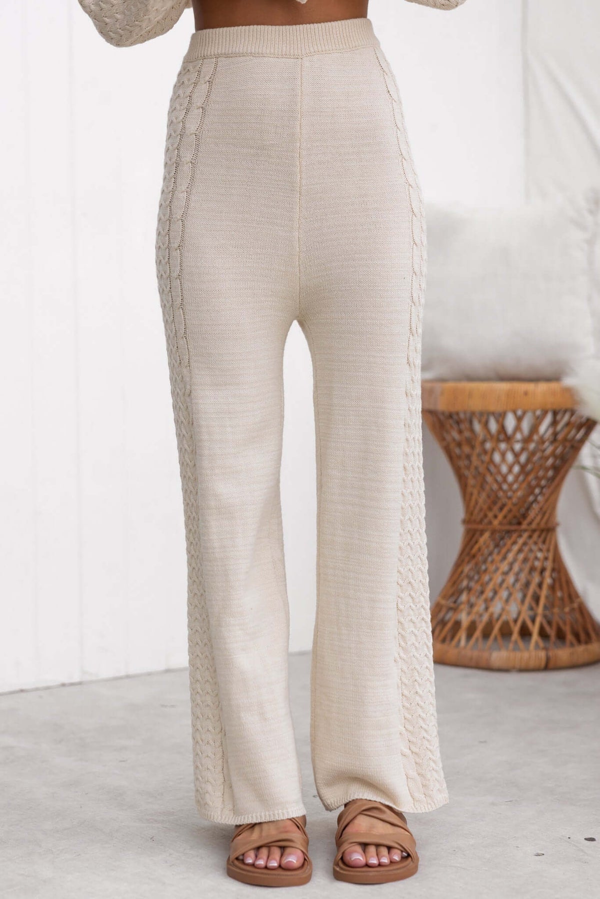 Jesse Pants, high-waisted, drop-crotch style, beige knit material with side detailing, perfect for a casual chic look.