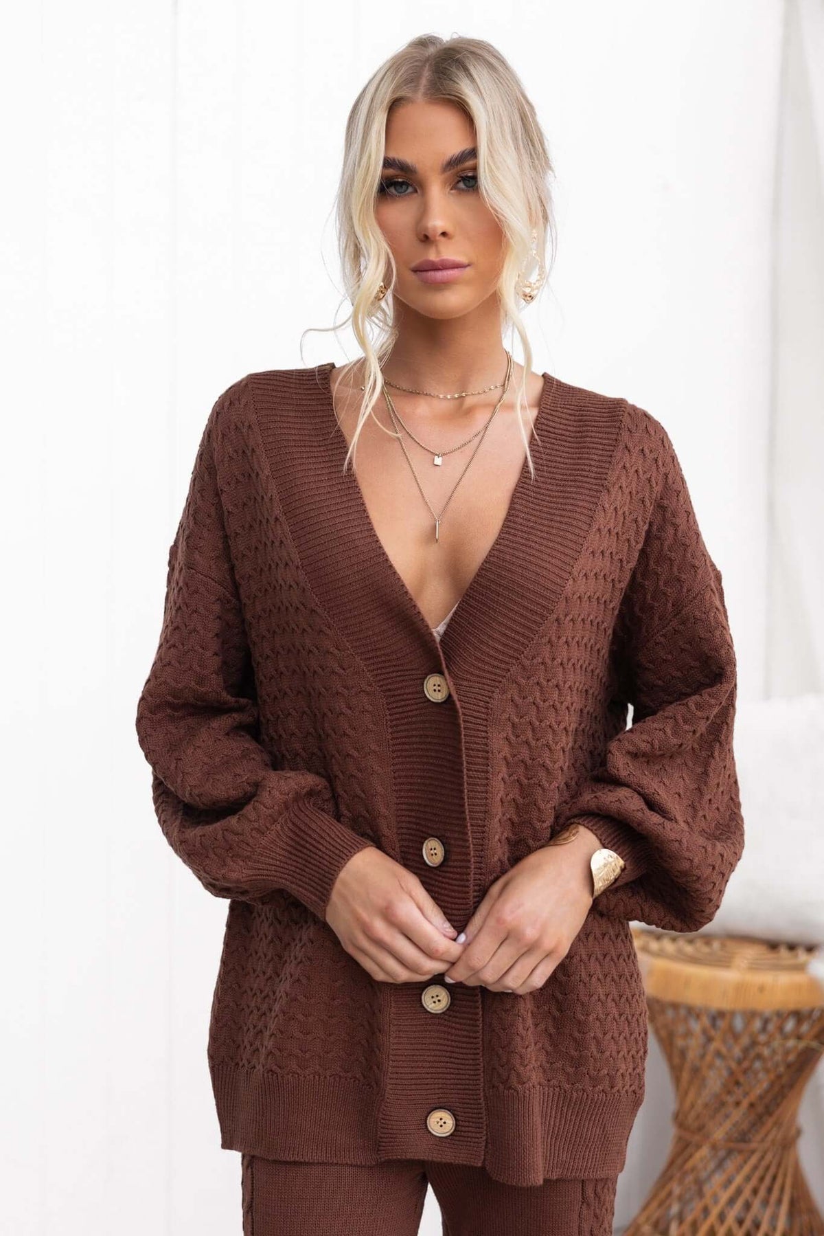 Brown Jesse Cardigan featuring a V-neckline, button-up front, and relaxed fit, crafted from stretchy knit material.