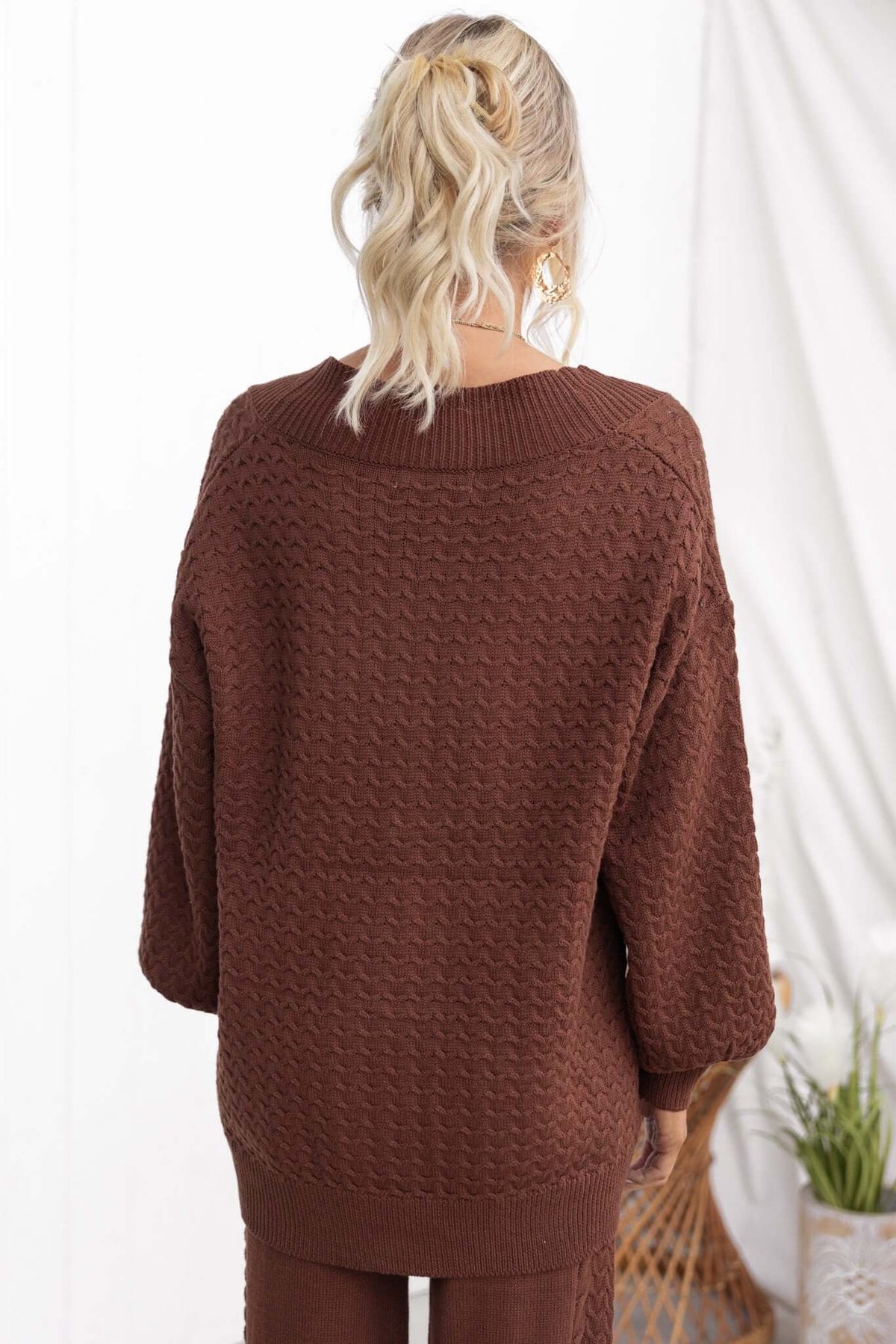 Back view of Jesse Cardigan in brown knit, featuring a relaxed fit and textured pattern.