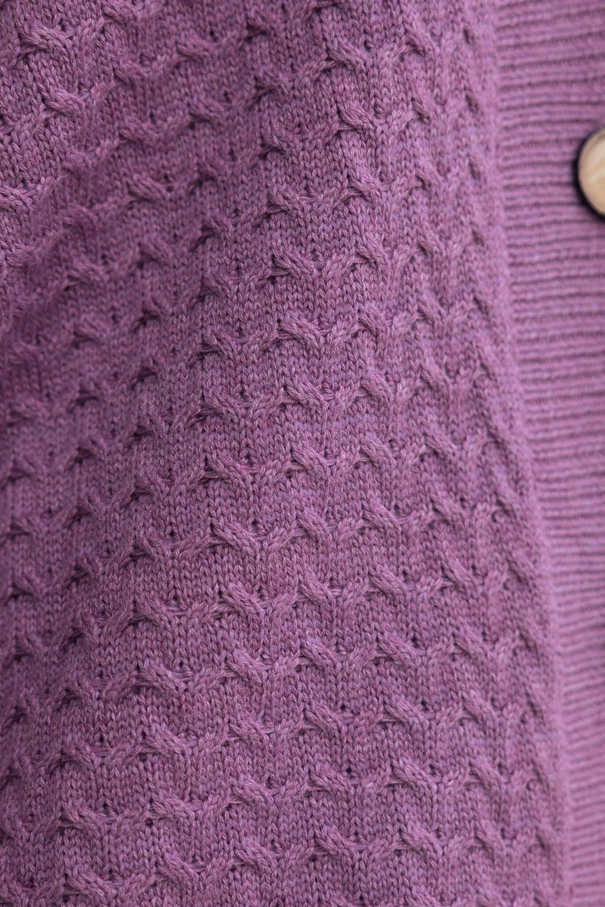 Close-up of Jesse Cardigan's soft knit texture in lavender with button detail.