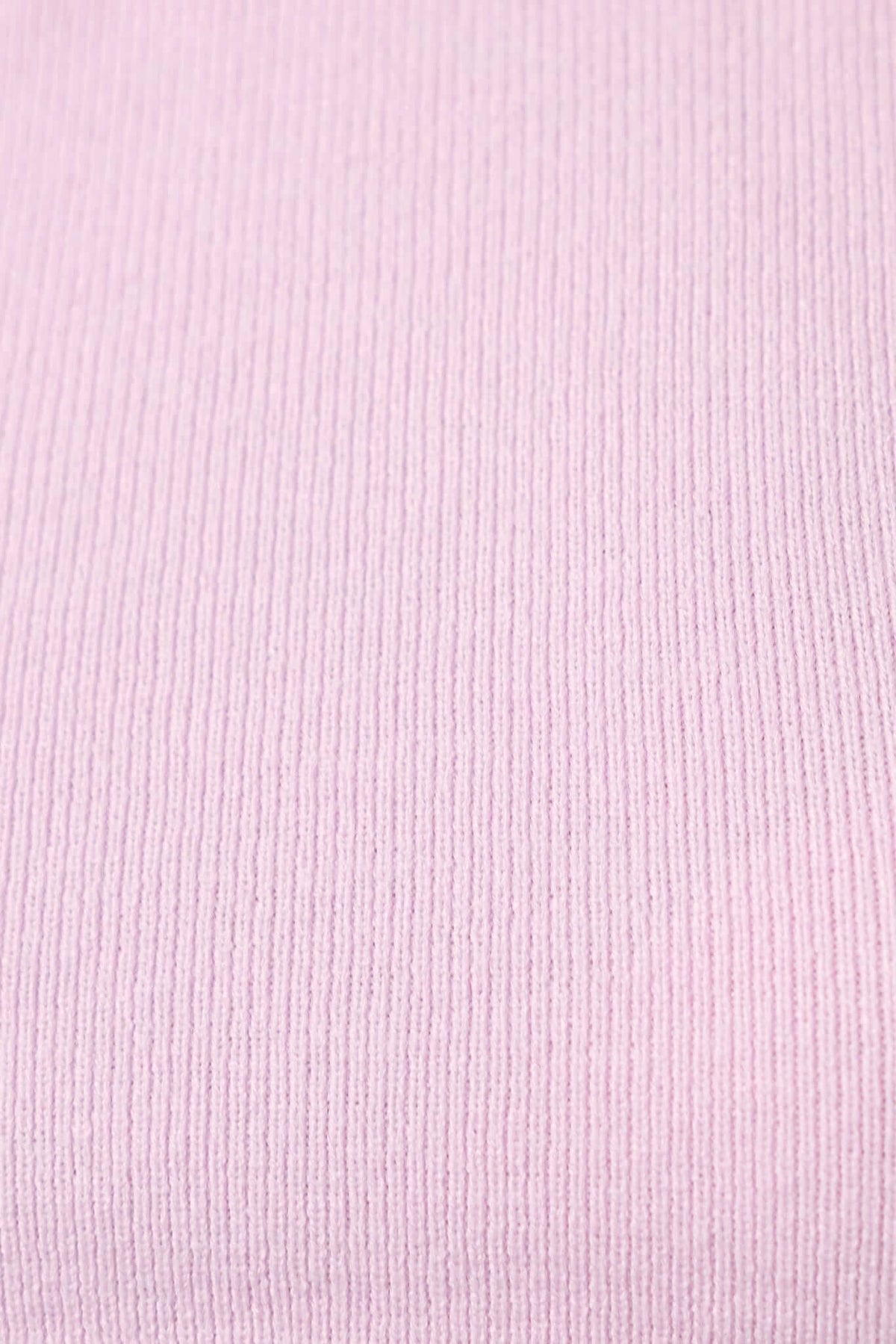 Close-up of soft pink knit fabric texture, ideal for stylish jumpers.