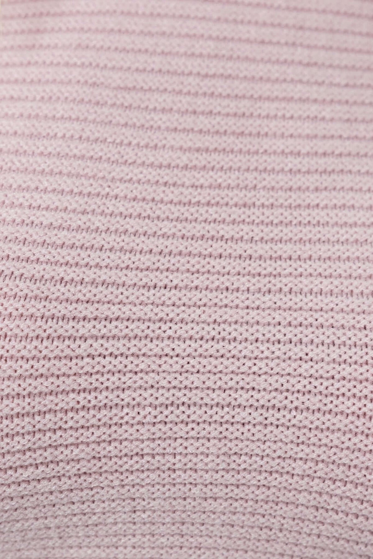 Close-up of soft pink knit fabric showcasing a textured striped pattern, ideal for a stylish jumper.