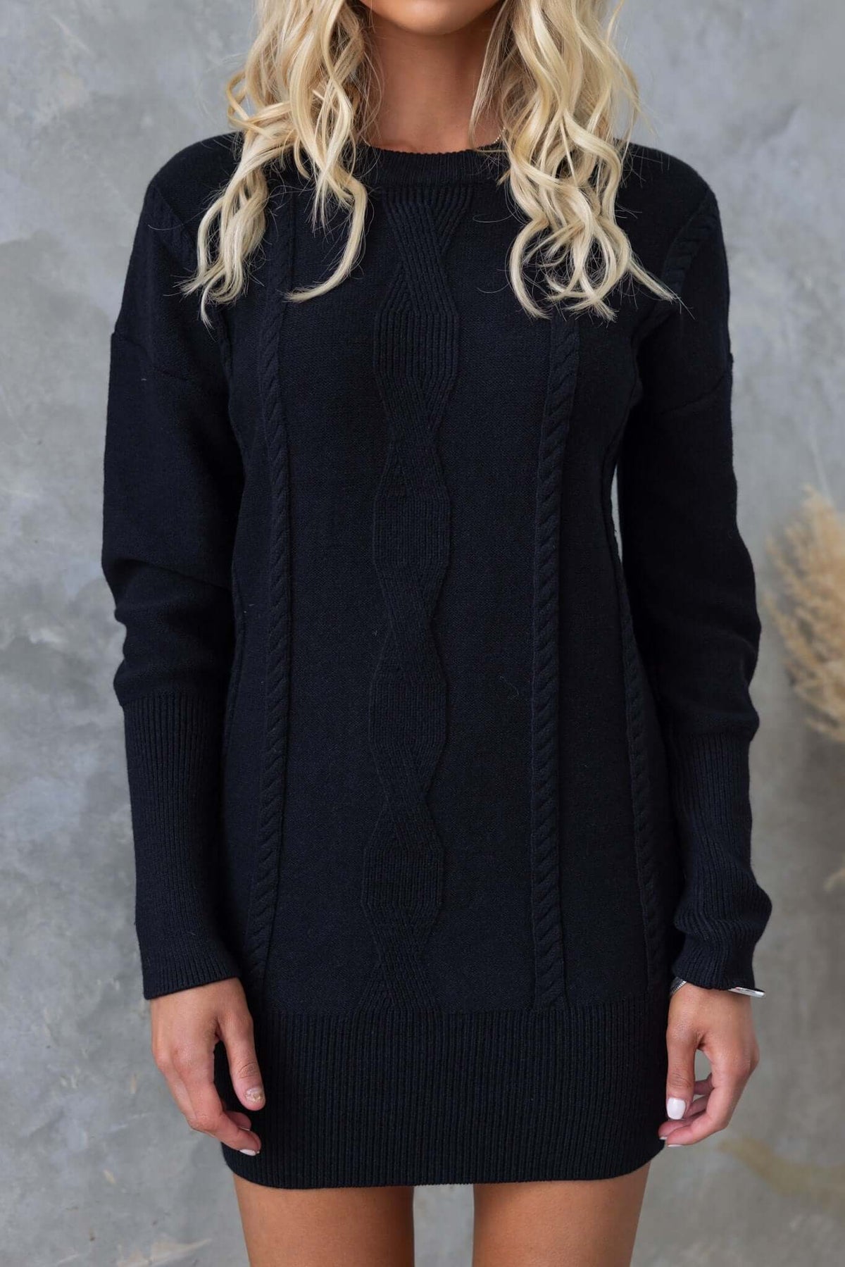 Black Beasley Dress with round neckline and cable knit detail, showcasing a relaxed fit and stretch knit material.