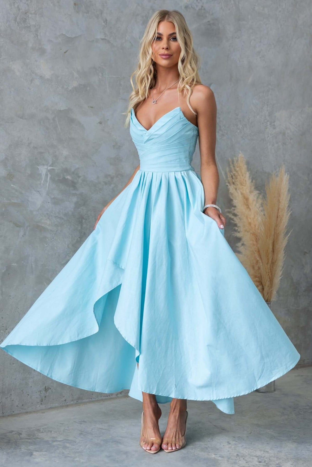 Kiss And Tell Maxi Dress in light blue, strapless design with asymmetric hem, perfect for special occasions.