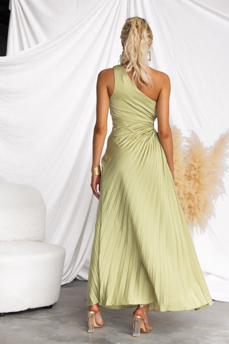 Back view of the Ottile Maxi Dress featuring a one-shoulder neckline and pleated design in soft green.