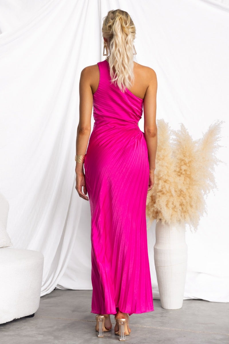 Model wearing a pink Ottile Maxi Dress with one-shoulder design and back view, styled with pleated fabric.