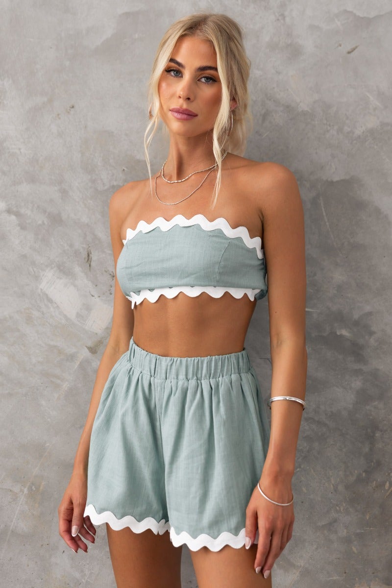 Take It Easy Top in mint green, strapless with scalloped trim, paired with matching shorts, showcasing a relaxed summer style.