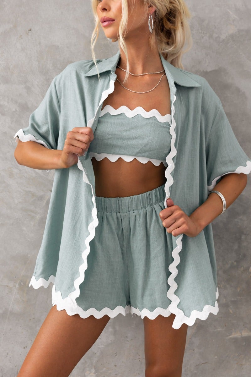 Model wearing the Take It Easy Shirt set in mint green, featuring a button-up shirt and scalloped trim shorts.