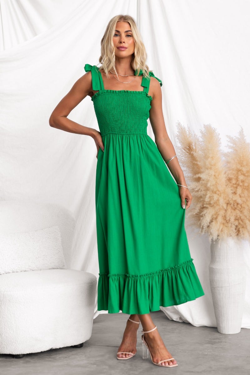 Qaniva Midi Dress in vibrant green, featuring adjustable tie straps and a flared hem, ideal for summer occasions.