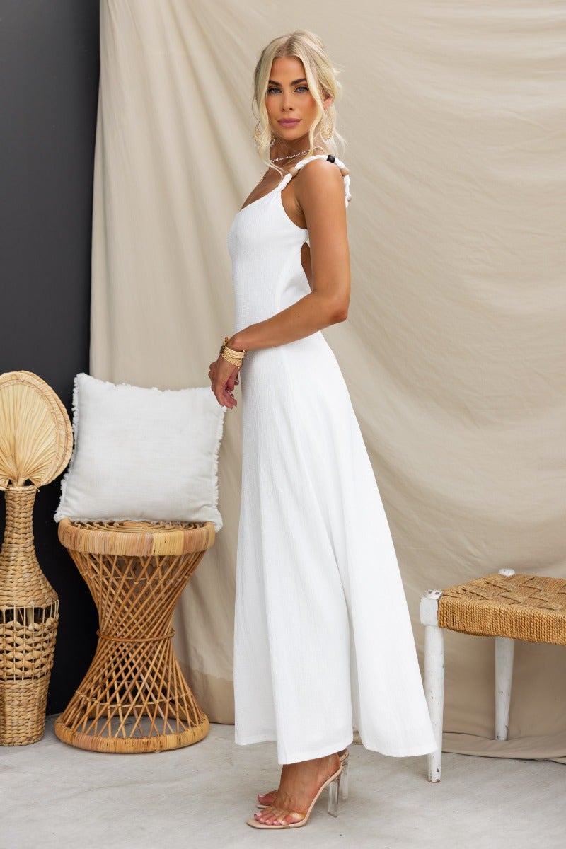 Elegant white Ranley maxi dress with bead detailing at straps, featuring a sleek fit and lightweight fabric.