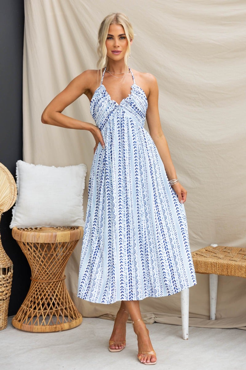 Qano Midi Dress featuring adjustable tie neckline and elegant abstract print, perfect for summer outings.