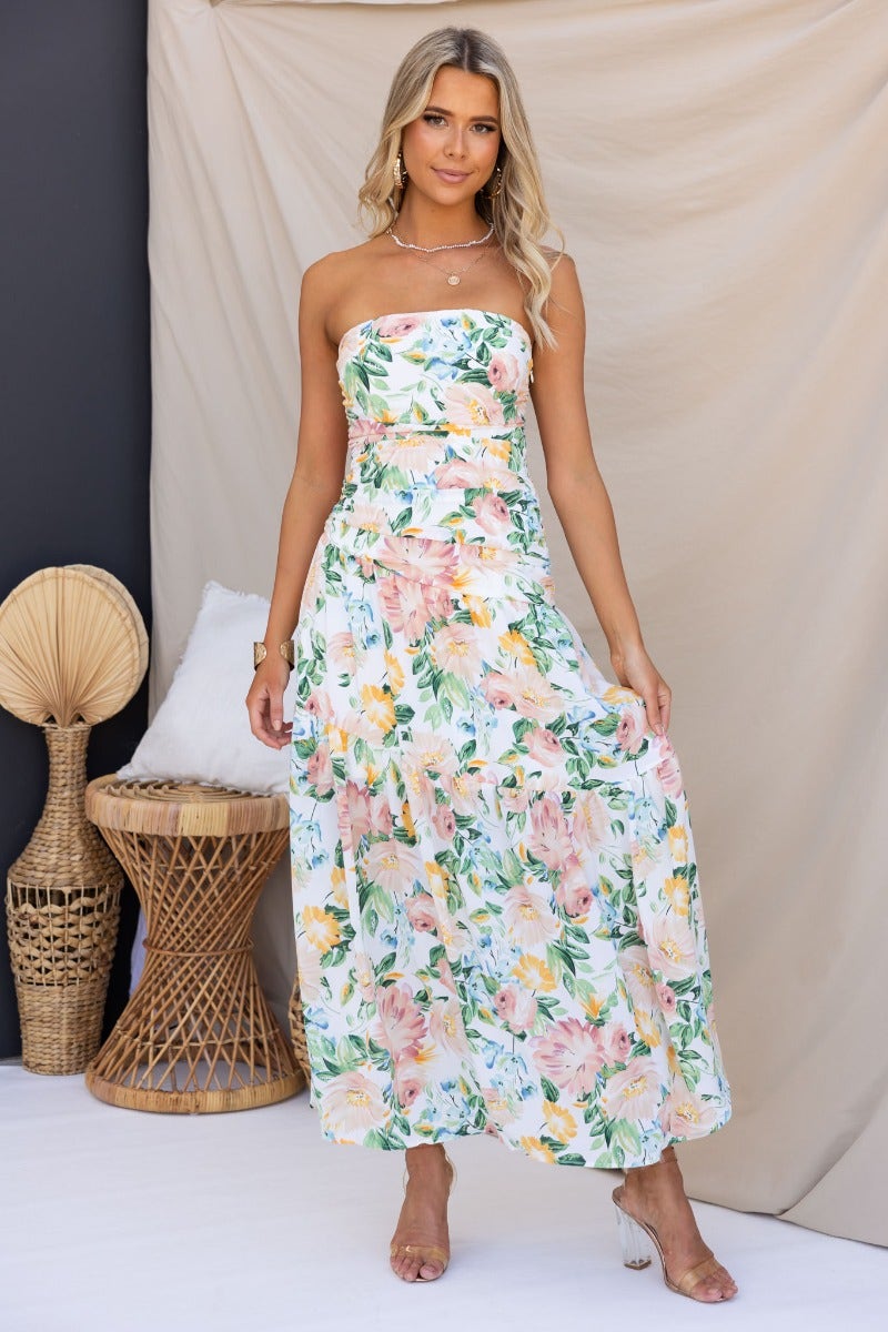 Blaine Maxi Dress: Strapless floral maxi dress with elastic back and side zip, featuring vibrant floral patterns.