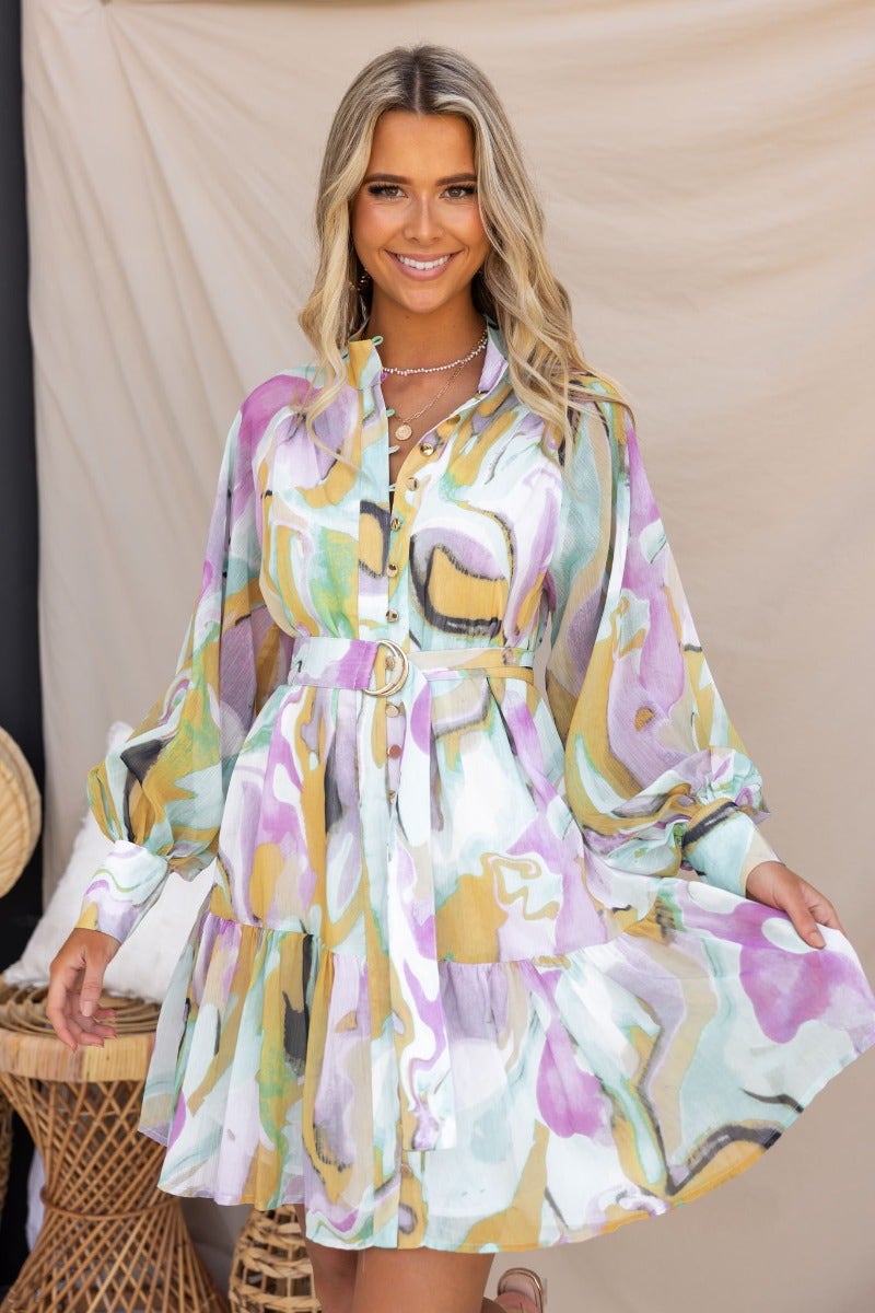 Orazio Dress featuring a multi-colour print, high neckline, and button-up front, styled with a removable belt.