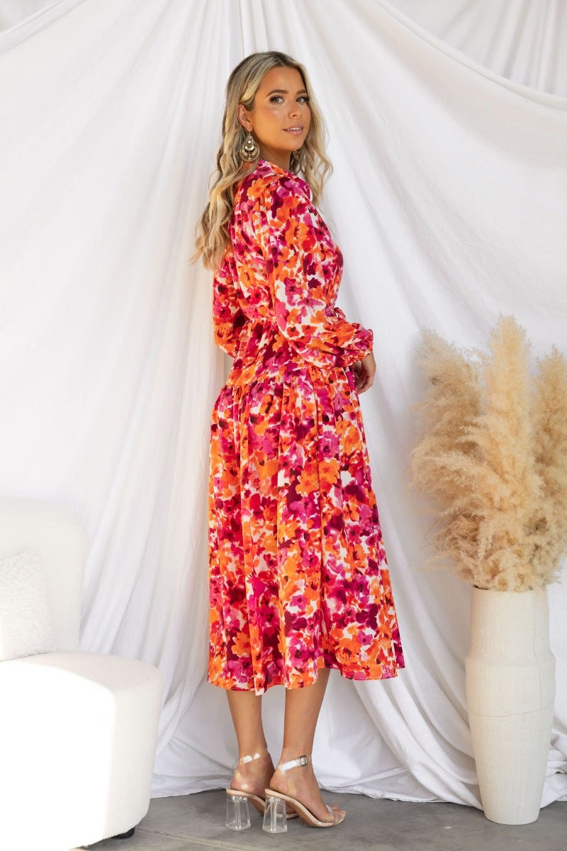 Floral print Andreas Midi Dress with high neckline and button-up detail, styled on a model against a neutral backdrop.