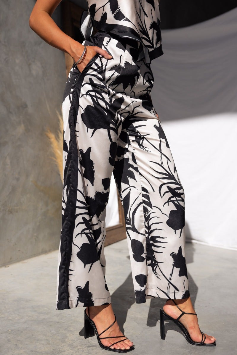Satin Persia Pants featuring an elastic waistband, pockets, and a stylish floral design, perfect for casual wear.