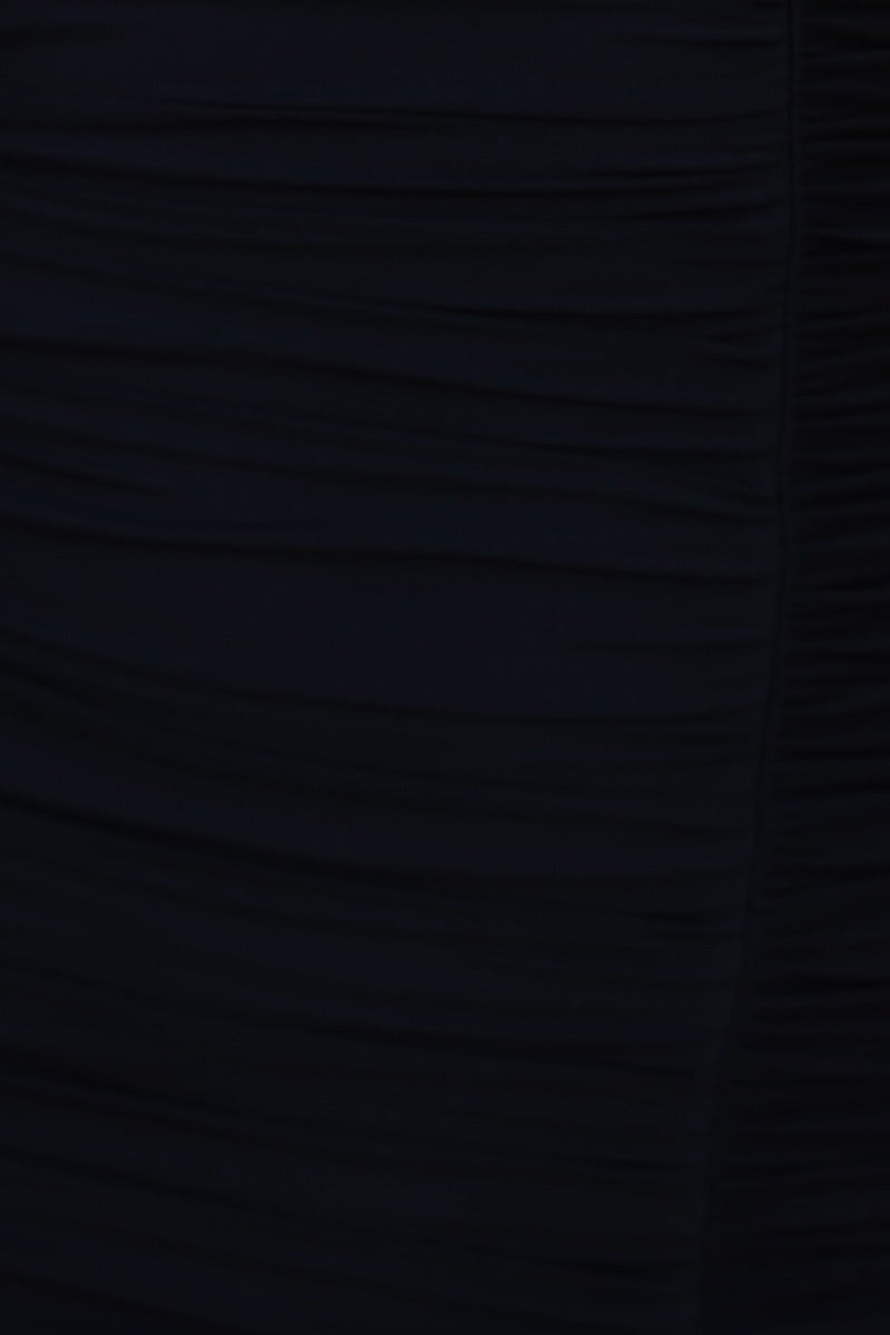 Close-up of the ruched fabric detail on the Opulence Midi Dress in black, showcasing its elegant texture.