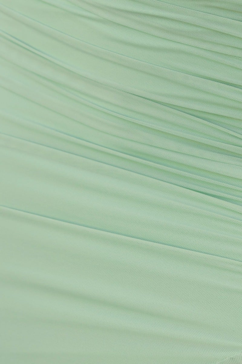 Close-up of ruching detail on mint green Opulence Midi Dress fabric, showcasing soft, textured design.