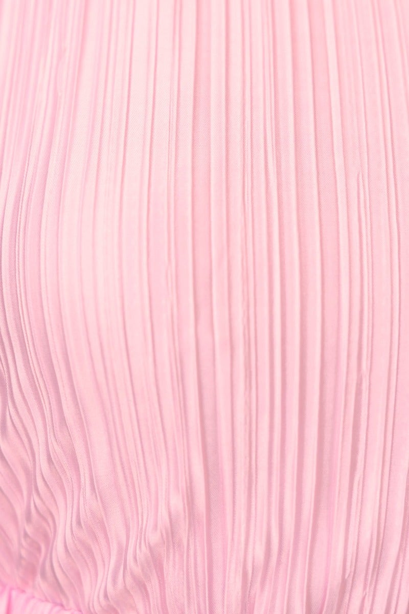 Close-up of pink accordion pleats on Tyran Maxi Dress, highlighting the elegant texture and soft fabric.