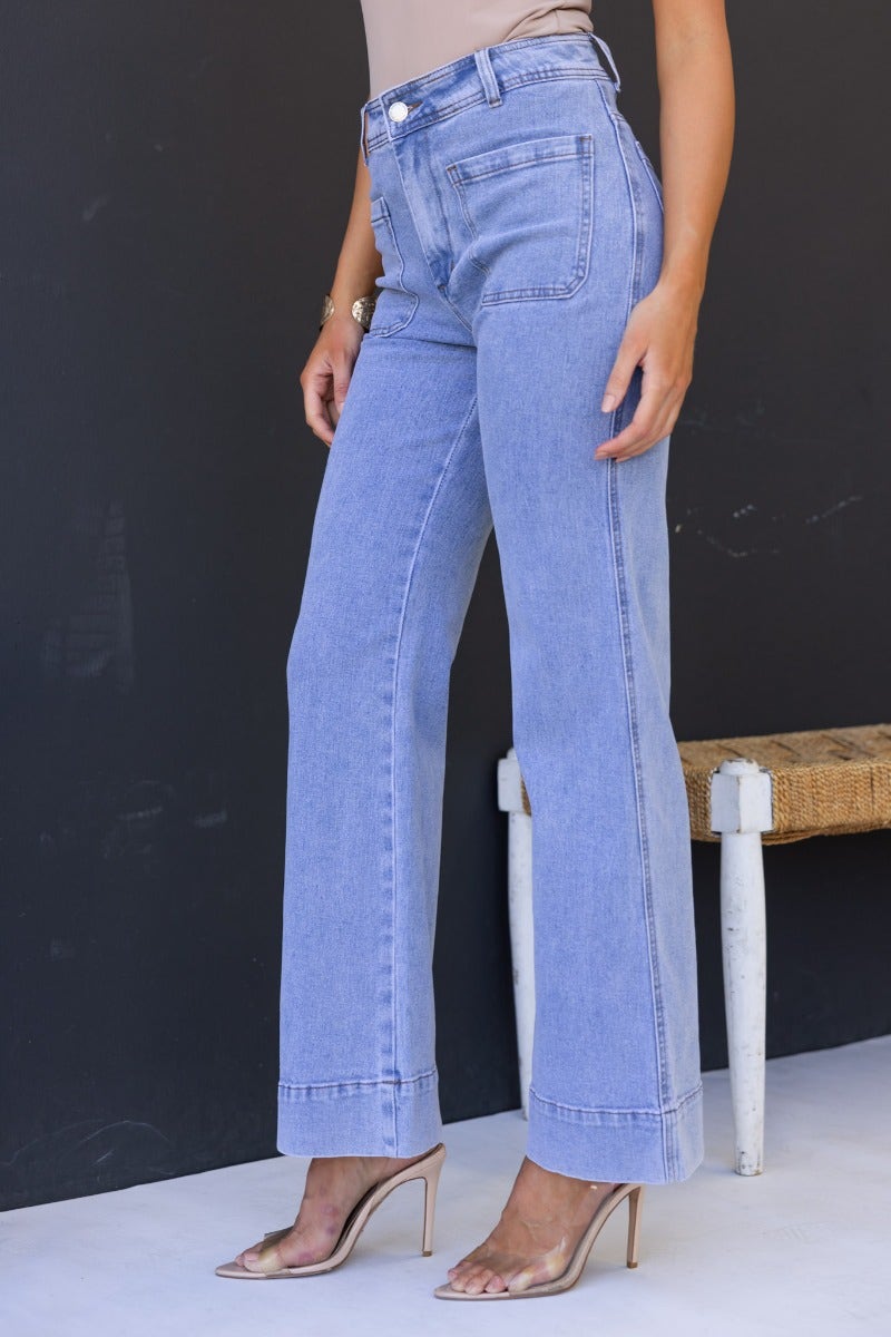 Lane Jeans featuring a mid-high waist fit, light blue denim, front and back pockets, perfect for casual looks.