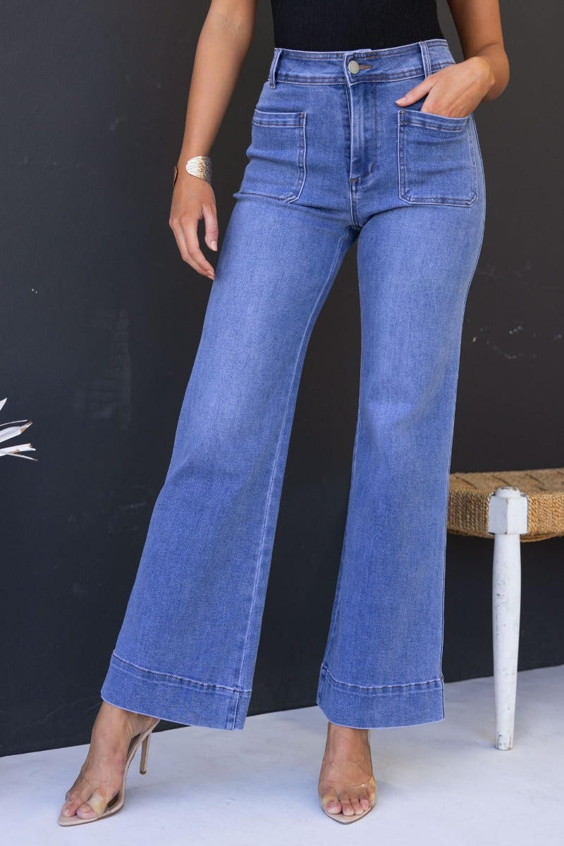 Lane Jeans mid-high waist denim with front and back pockets, featuring a relaxed fit, stylish wide-leg design.