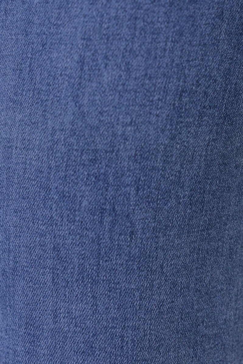 Close-up of blue denim fabric showing texture, suitable for Lane Jeans with stretch for comfort.