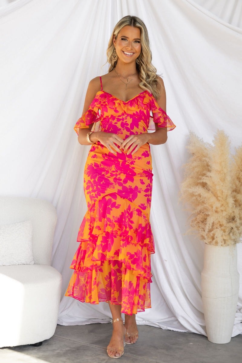 Colorful floral print Costa Rica maxi dress with off-shoulder ruffle sleeves and multi-tiered skirt.