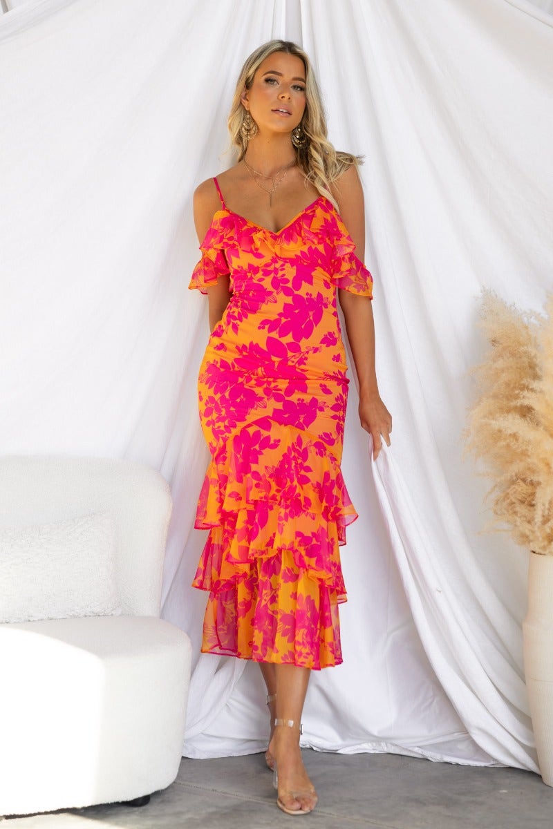 Floral print Costa Rica maxi dress with adjustable straps and ruffle sleeves, featuring a multi-tier skirt.