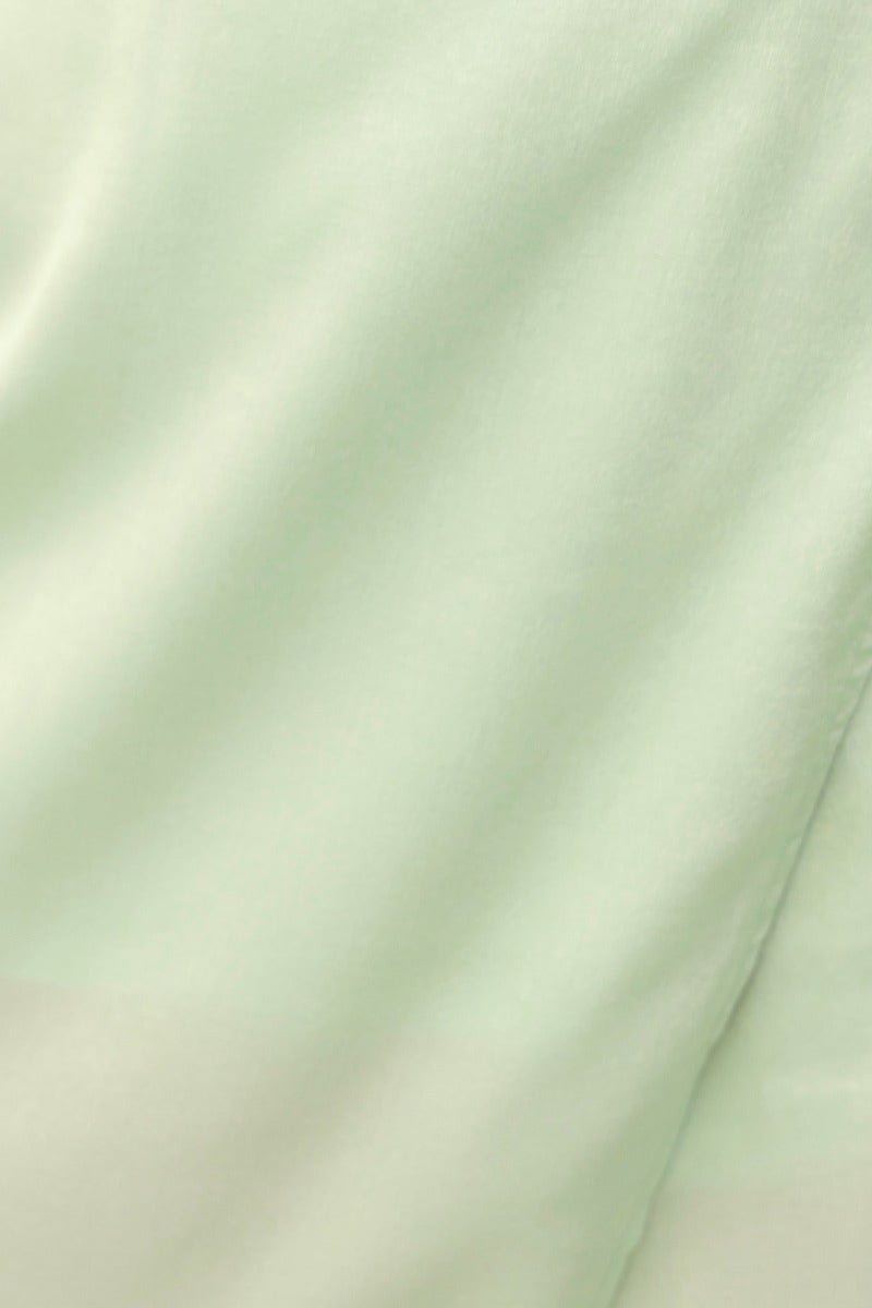 Close-up of soft, mint green fabric showing smooth texture, ideal for the Nerida Top.