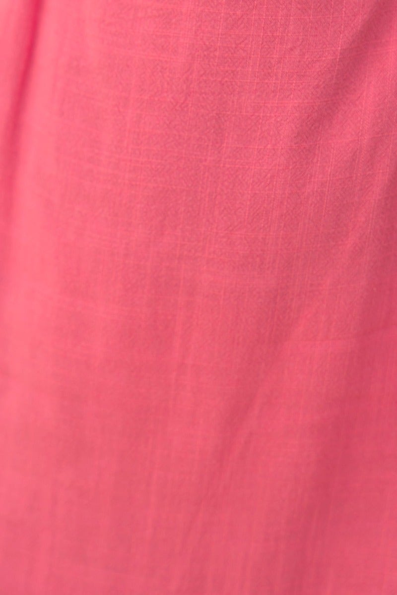 Close-up of soft pink linen fabric showcasing texture for the Calia Dress, featuring a lightweight and breathable design.