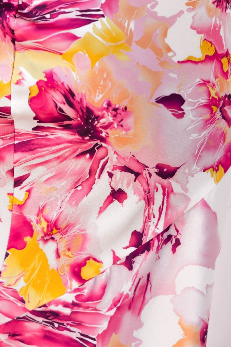 Close-up of floral print in pink and yellow hues on the Just Imagine Maxi Dress, featuring vibrant blossoms.