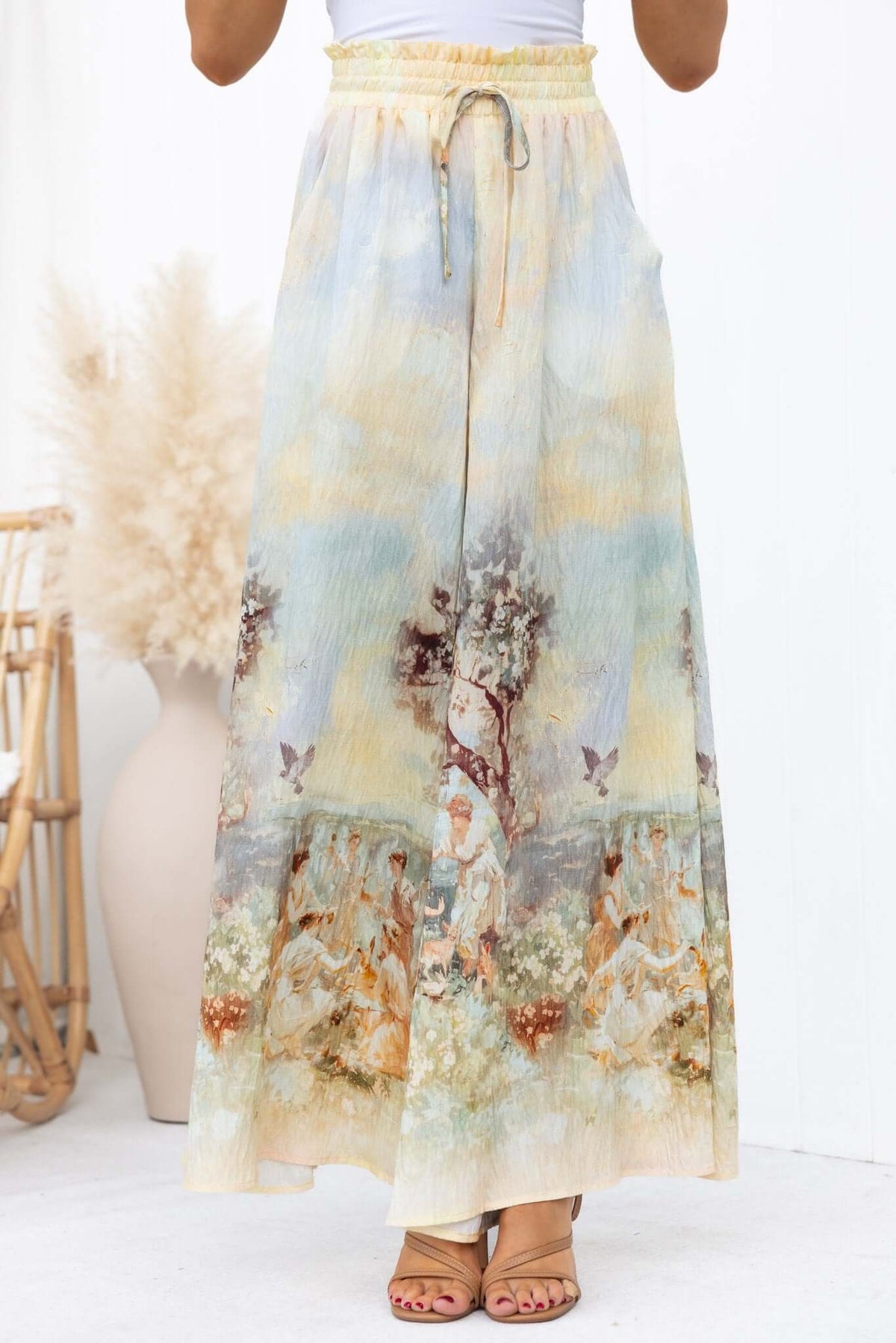 Grafton Pants featuring an abstract print, mid-high waist, drawstring, and wide legs in a flowy design.